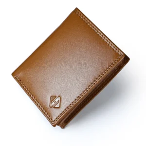 Closed tan vertical leather wallet with fine surface texture, matching stitching and an embossed corner emblem