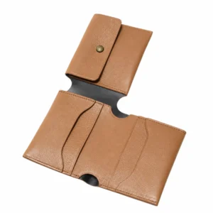 Open tan leather wallet showing the antique brass snap closure and interior